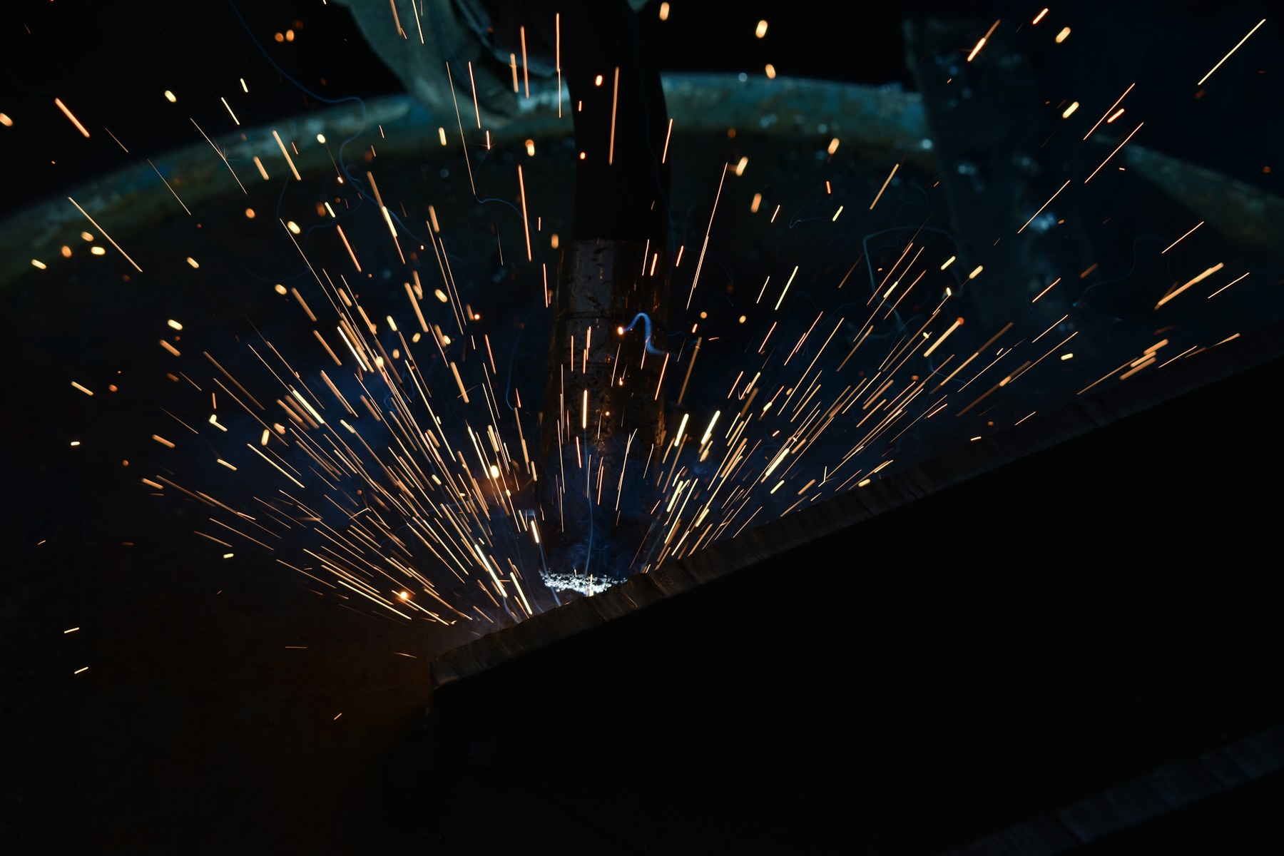 Industrial welding work representing STZINC custom cargo securement manufacturing review.