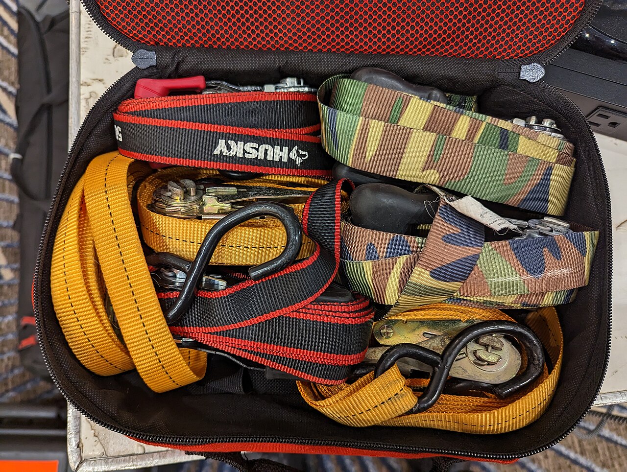 Assorted ratchet tie-down straps used as licensed application reference media